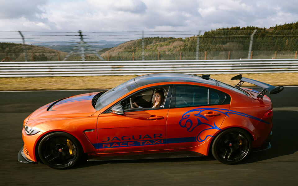 Orange-blue Jaguar on the Nürburgring