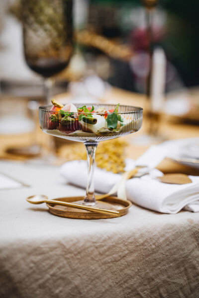 Dessert in a high transparent KPM bowl with golden spoon