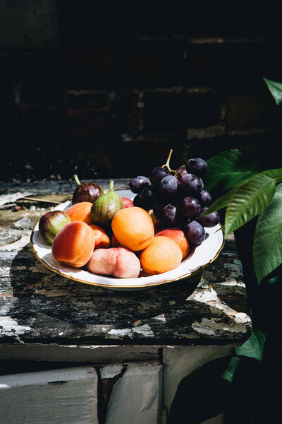 Fruit in a KPM bowl placed on a bench