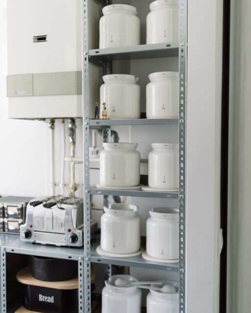 Kitchen shelf filled with KPM ball mills