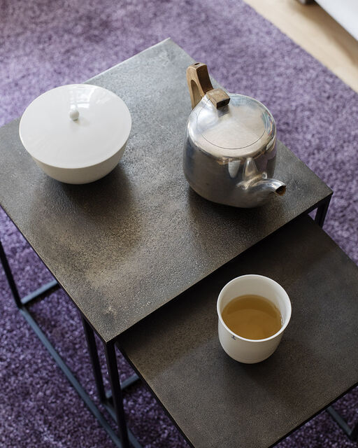 A tea set on the living room table, including a LAB cup from KPM