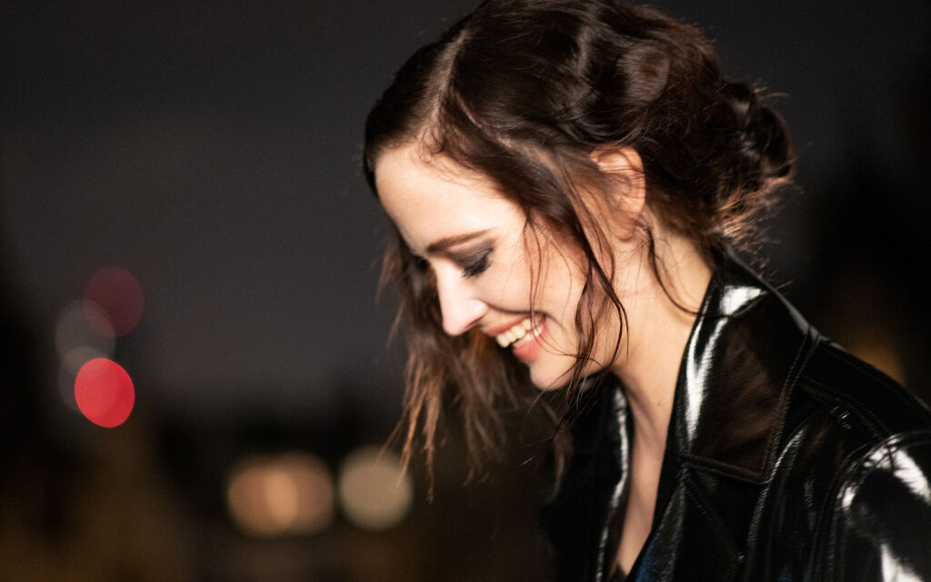 Portrait photo of actress Eva Green with shimmering black blazer