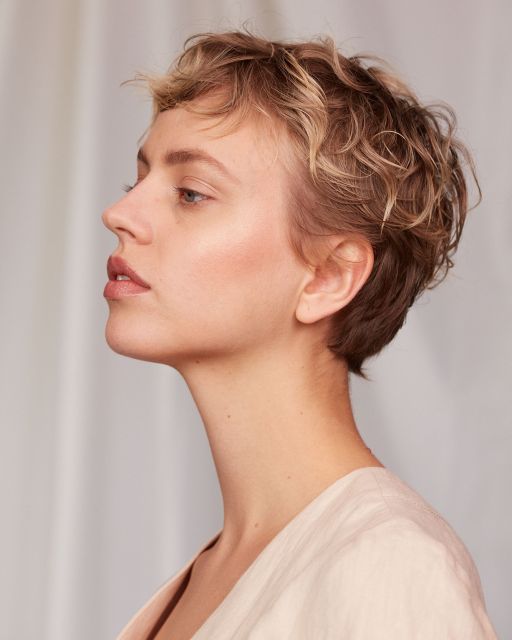 Close up of a young woman with short hair and natural complexion