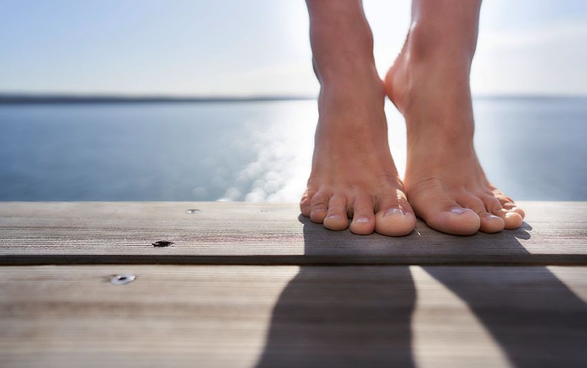 Close-up of a pair of feet on a diving platform at Ammersee