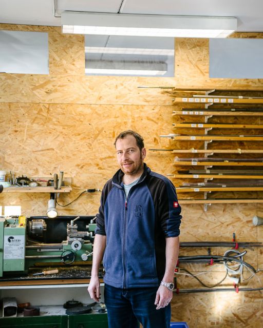 Instrument maker Hans Krinner stands in his workshop