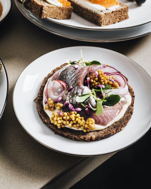 Skilfully topped crisp bread on white porcelain plate