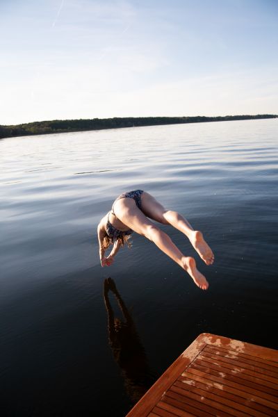 Girl takes a header into the water