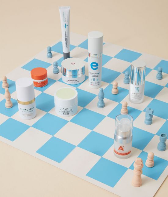 Eye creams on a blue and beige chessboard