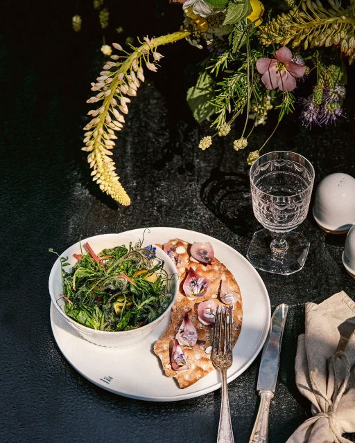 Lab plate and Kurland glass with salad and bread on table