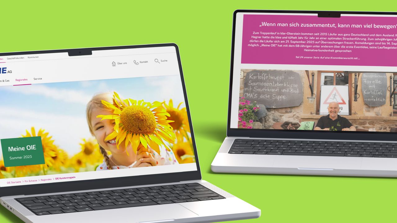 Two laptops side by side display the home page and an article page from the digital customer magazine “My OIE.”