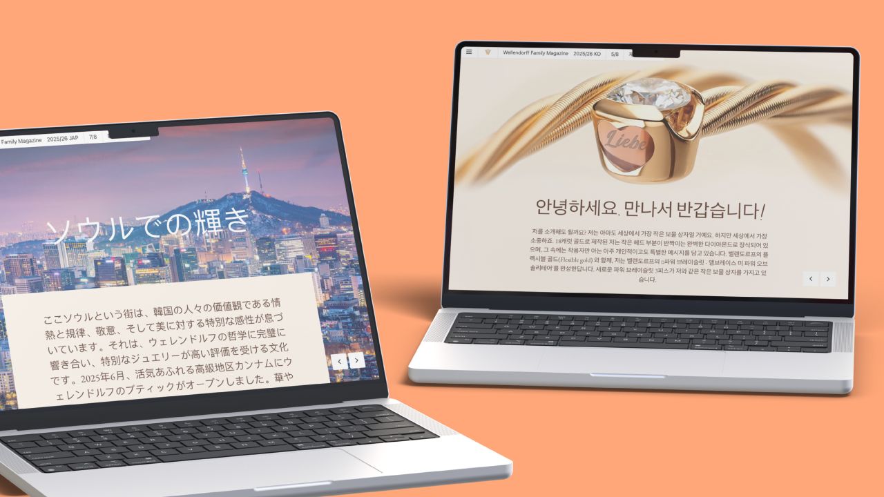 Two open laptops display articles from the digital Wellendorff family magazine, on the left in Japanese and on the right in Korean.